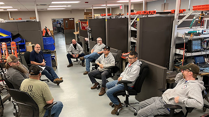 CRF team members talk safety during a briefing. From left to right: Daniel Spangler, Merlin “Skip” Dixon, Jeff Ost, Anthony Hall, Corey Croxell, Nam Nguyen, Ben Truong and Kyle Olson  CRF team members talk safety during a briefing. From left to right: Daniel Spangler, Merlin “Skip” Dixon, Jeff Ost, Anthony Hall, Corey Croxell, Nam Nguyen, Ben Truong and Kyle Olson