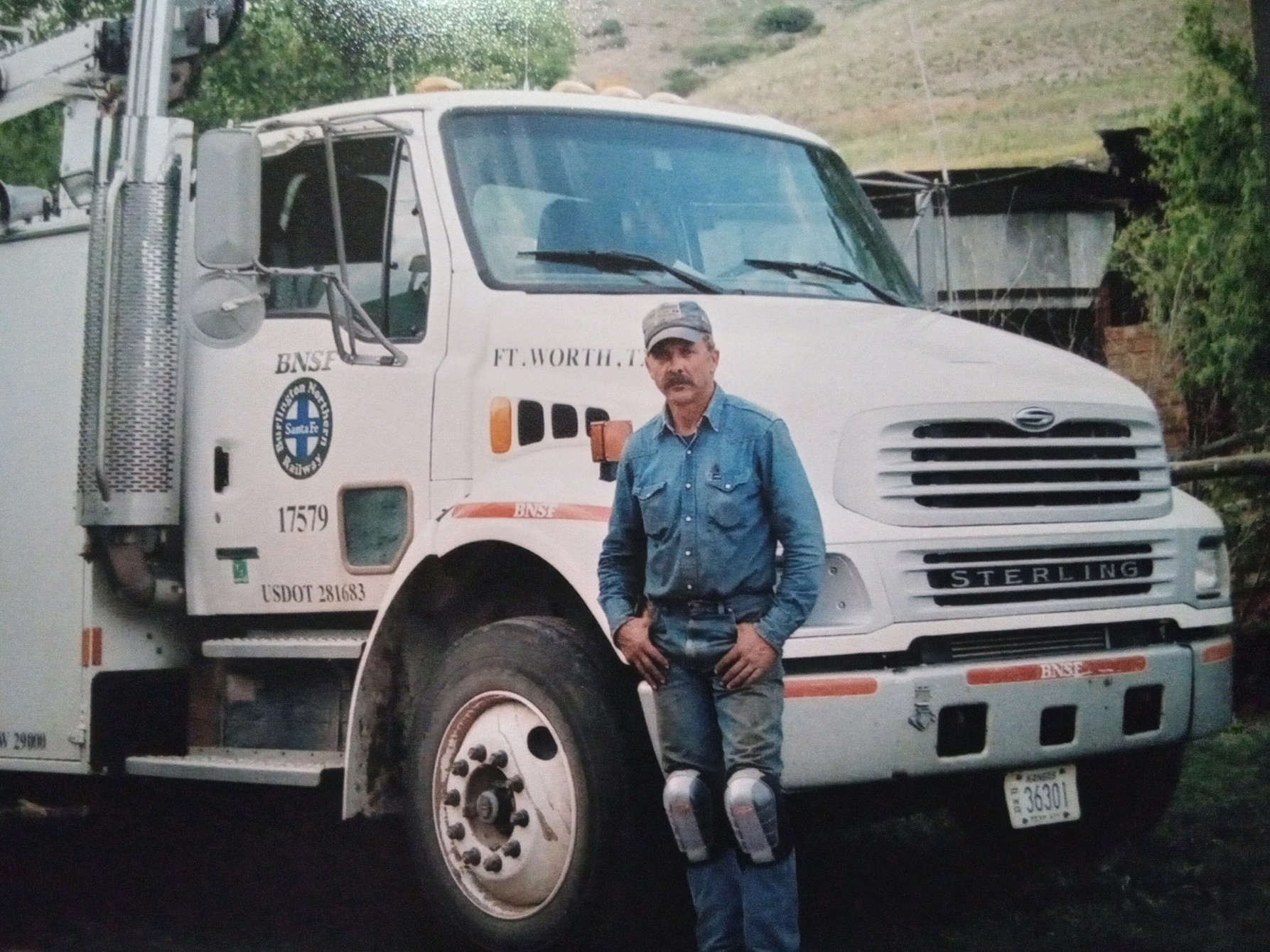 Greg Hampson standing in front of a BNSF vehicle in 2004 Greg Hampson standing in front of a BNSF vehicle in 2004