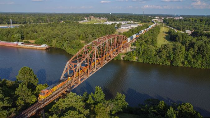 A BNSF train crosses the Tennessee-Tombigbee Waterway in Amory, Mississippi. A BNSF train crosses the Tennessee-Tombigbee Waterway in Amory, Mississippi.