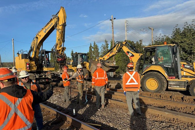 Engineering teams pause frequently to discuss job safety.  Engineering teams pause frequently to discuss job safety.