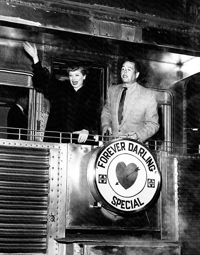 Actress and comedian Lucille Ball and her husband actor and musician Desi Arnaz stand on the rear platform of a Santa Fe Railway passenger car in 1956. Actress and comedian Lucille Ball and her husband actor and musician Desi Arnaz stand on the rear platform of a Santa Fe Railway passenger car in 1956.