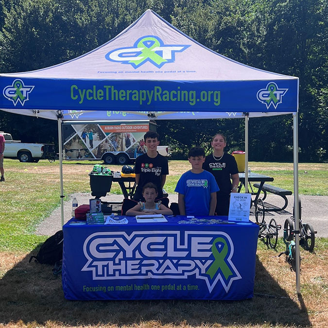 The signage’s green ribbon signifies mental health awareness.  The signage’s green ribbon signifies mental health awareness.