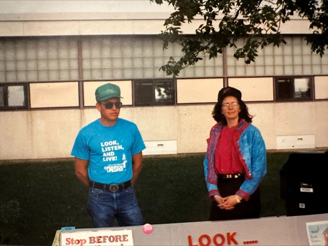 Dale Dannewitz volunteers with Locomotive Engineer Cheri Bonebrake at an Operation Lifesaver event circa 1994.  Dale Dannewitz volunteers with Locomotive Engineer Cheri Bonebrake at an Operation Lifesaver event circa 1994.
