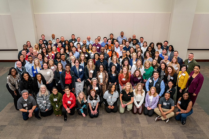 Farmer with the Diversity and Inclusion Summit attendees. Farmer with the Diversity and Inclusion Summit attendees.
