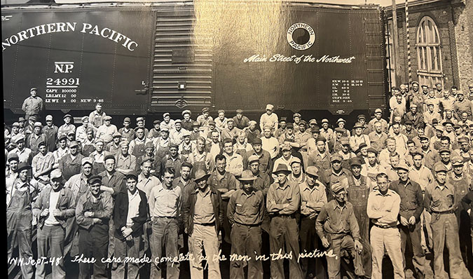 Kimberly’s great-grandfather, front row with his foot on the ledge   Kimberly’s great-grandfather, front row with his foot on the ledge