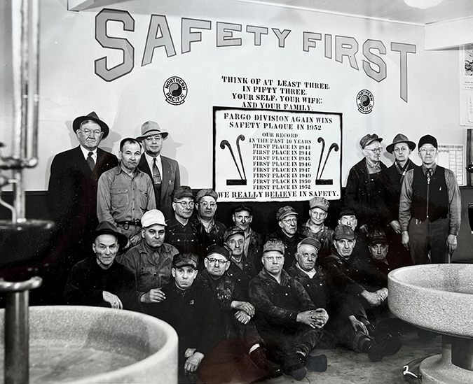 Fargo Division safety celebration 1952. Cari Elstad’s great-grandfather, Arthur Elstad, is seated at left in the second row wearing black hat. Fargo Division safety celebration 1952. Cari Elstad’s great-grandfather, Arthur Elstad, is seated at left in the second row wearing black hat.
