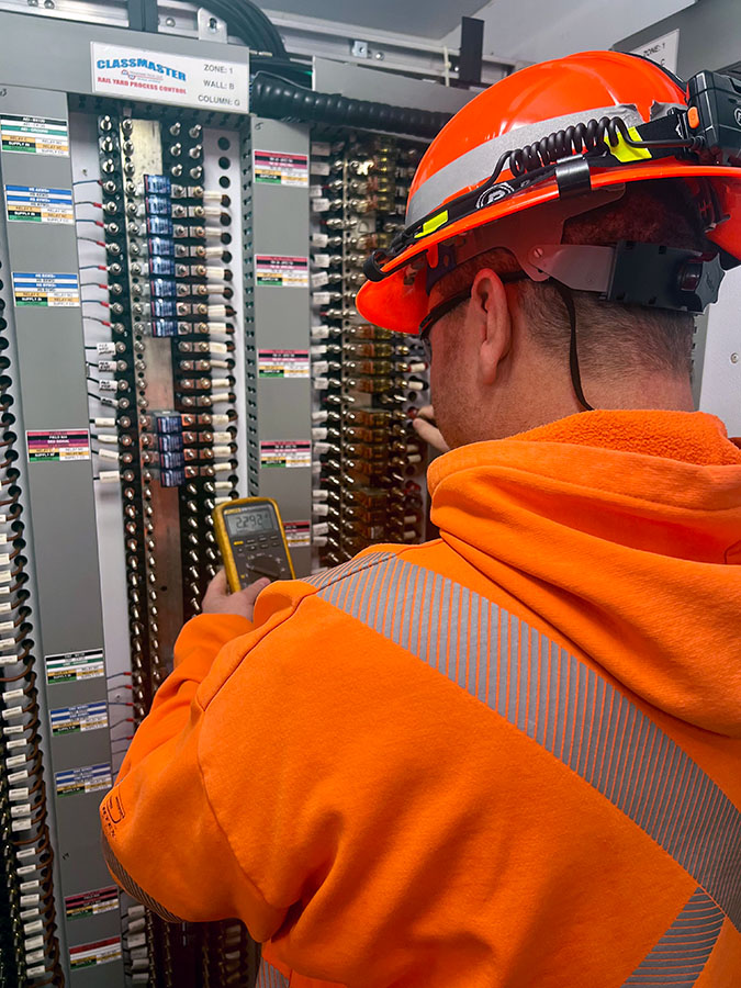 Locke checks track circuit voltages.  Locke checks track circuit voltages.