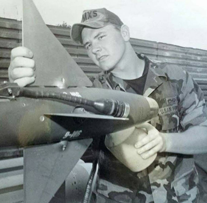 Locke inspects an AIM-9 missile while serving in the Air Force.  Locke inspects an AIM-9 missile while serving in the Air Force.