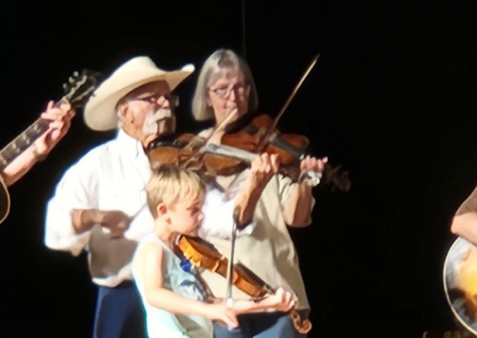 The youngest, Clark Huguenin, plays with grandfather Dan Everts and friend. The youngest, Clark Huguenin, plays with grandfather Dan Everts and friend.
