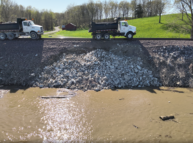 Riprap is placed to repair and protect a damaged embankment on the River Subdivision. Riprap is placed to repair and protect a damaged embankment on the River Subdivision.