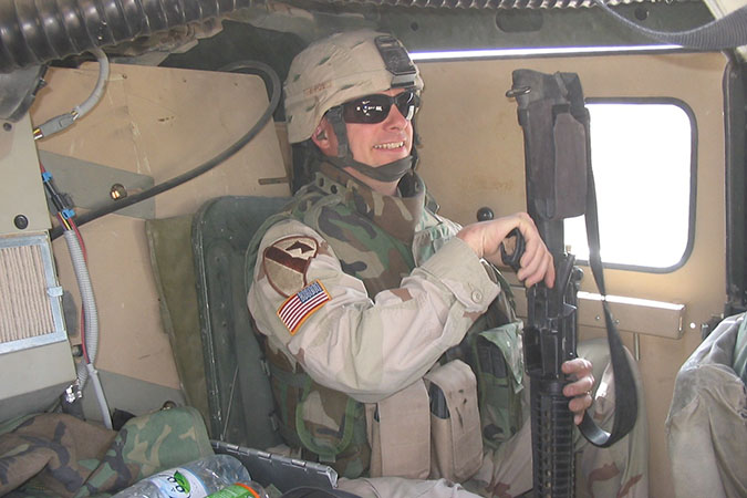 Fisher in Iraq, during his deployment  Fisher in Iraq, during his deployment
