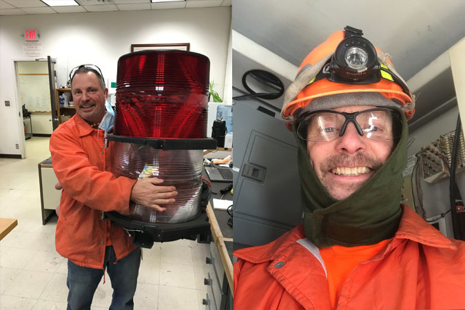 Fisher holding a tower light beacon, the top light on a telecom tower Fisher holding a tower light beacon, the top light on a telecom tower