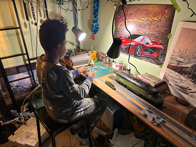 Daecian working on a model railroad layout.  Daecian working on a model railroad layout.