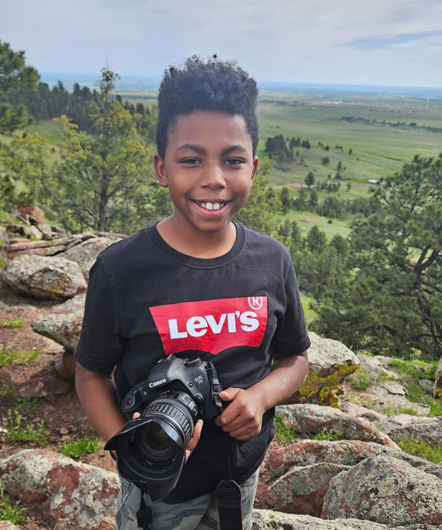 Daecian holding his camera.  Daecian holding his camera.