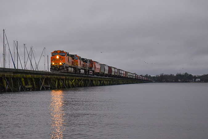 A trio of BNSF locomotives on Norfolk Southern’s Neuse River bridge in New Bern, North Carolina, was captured by Jon Celotto.  A trio of BNSF locomotives on Norfolk Southern’s Neuse River bridge in New Bern, North Carolina, was captured by Jon Celotto.