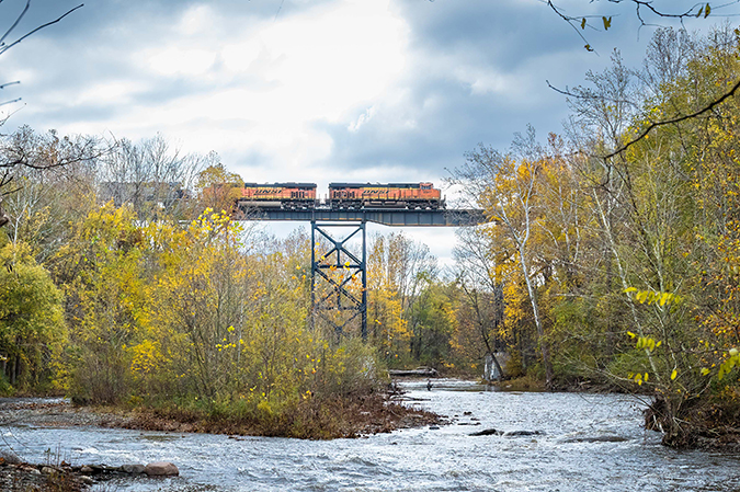 An all-BNSF consist leads a Norfolk Southern train over Elk Creek at Lake City, Pennsylvania. Photo by Mike Hauk.  An all-BNSF consist leads a Norfolk Southern train over Elk Creek at Lake City, Pennsylvania. Photo by Mike Hauk.