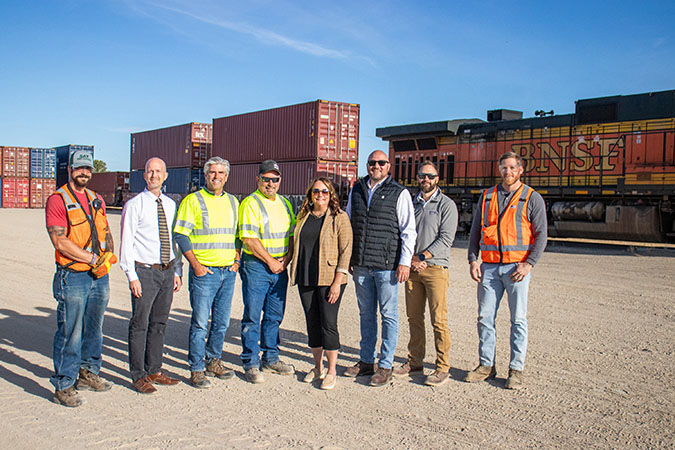 The 1,000th BNSF train that RMG loaded; from left to right: Conductor Michael Berman; Minot Area Chamber EDC Mark Lyman; RMG CEO Greg Oberting; RMG General Manager Chris Rehder; Minot Area Chamber EDC CEO Brekka Kramer; BNSF Supt. of Operations Dave McCann; BNSF Terminal Manager (Minot) Andrew Sprague; and BNSF Terminal Trainmaster (Minot) Sam Huff.  The 1,000th BNSF train that RMG loaded; from left to right: Conductor Michael Berman; Minot Area Chamber EDC Mark Lyman; RMG CEO Greg Oberting; RMG General Manager Chris Rehder; Minot Area Chamber EDC CEO Brekka Kramer; BNSF Supt. of Operations Dave McCann; BNSF Terminal Manager (Minot) Andrew Sprague; and BNSF Terminal Trainmaster (Minot) Sam Huff.