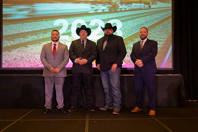 Left to right, members of the team recognized at BNSF’s Employees of the Year: Mark Roybal, Jon Mecham, Nick Garibay, and Nick DeRieux  Left to right, members of the team recognized at BNSF’s Employees of the Year: Mark Roybal, Jon Mecham, Nick Garibay, and Nick DeRieux