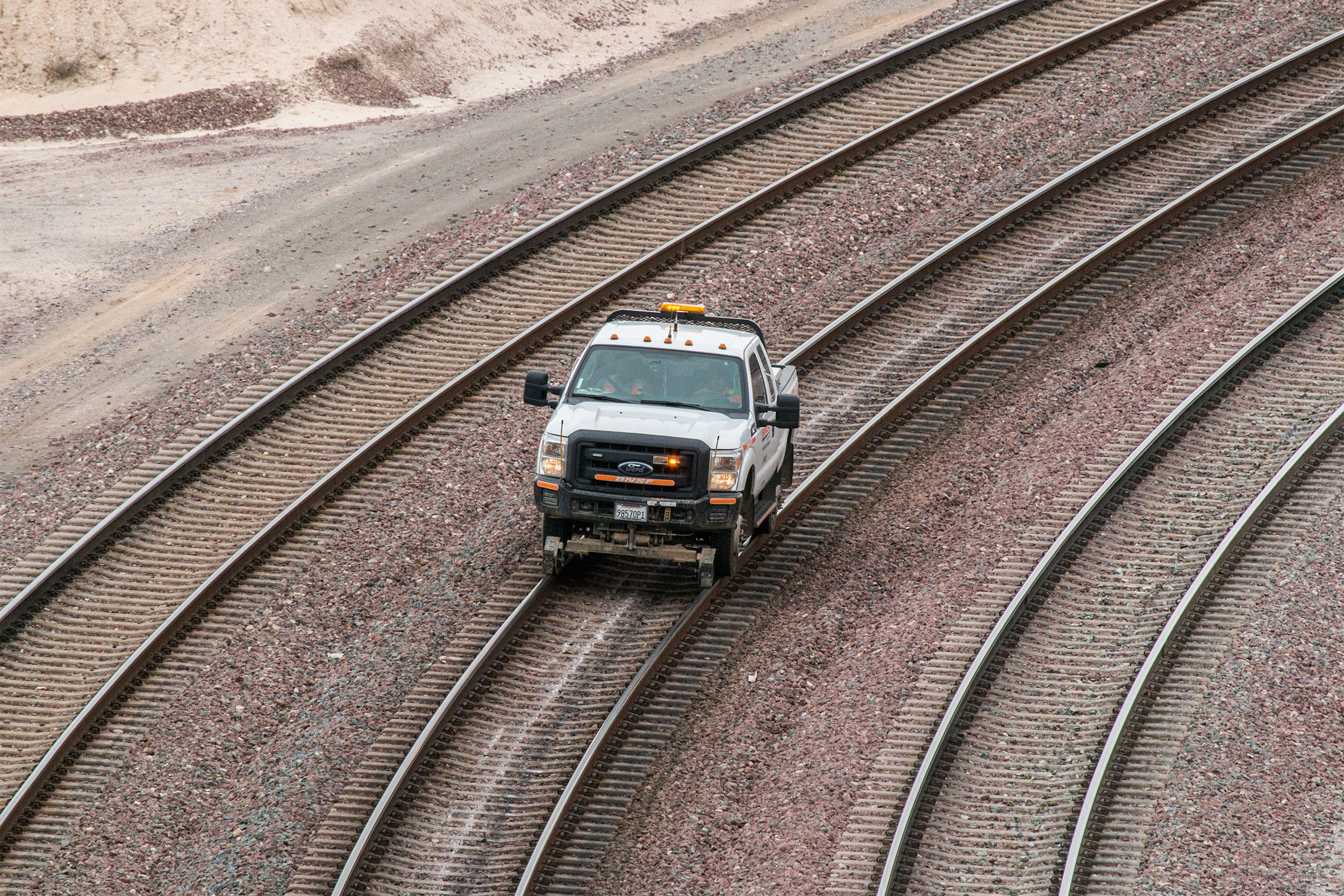 Hyrail vehicles can travel on both train tracks and roads.  Hyrail vehicles can travel on both train tracks and roads.