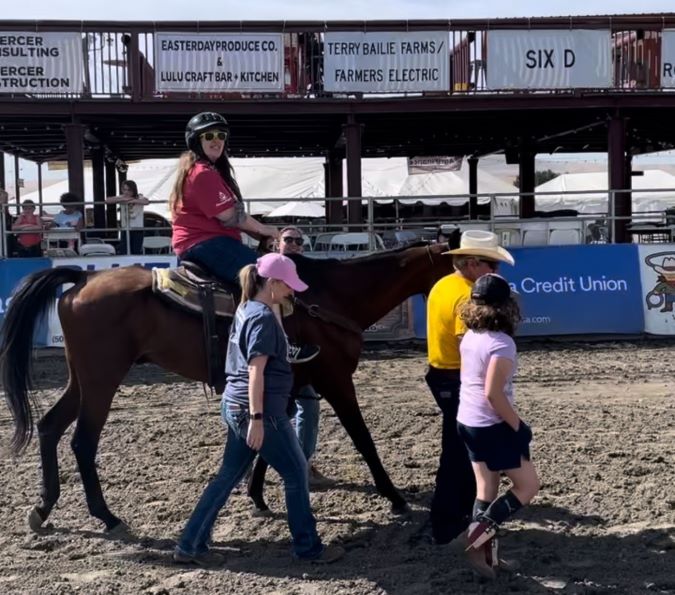 Cassie McCord on a horse during a Rascal Rodeo event Cassie McCord on a horse during a Rascal Rodeo event