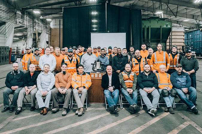 Members of the Twin Cities Division Mechanical team gather around the Safety Bell they’ve just been awarded at BNSF’s Northtown Yard in Minneapolis, Minnesota.  Members of the Twin Cities Division Mechanical team gather around the Safety Bell they’ve just been awarded at BNSF’s Northtown Yard in Minneapolis, Minnesota.