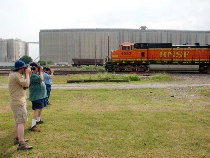 Railfans enjoy train spotting from a safe distance outside of railroad property during a 24 Hours at Saginaw event at the Saginaw Interlocker. Railfans enjoy train spotting from a safe distance outside of railroad property during a 24 Hours at Saginaw event at the Saginaw Interlocker.