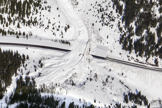 The path of this area’s avalanches can be seen in the center. Underneath this path is a snow shed that is strategically placed to divert the snow over the tracks.  The path of this area’s avalanches can be seen in the center. Underneath this path is a snow shed that is strategically placed to divert the snow over the tracks.