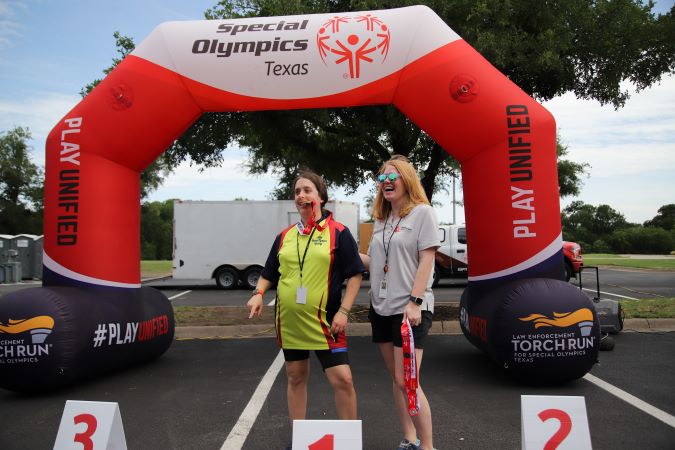 BNSF’s Katie Hower presenting a medal to a Special Olympics athlete.  BNSF’s Katie Hower presenting a medal to a Special Olympics athlete.