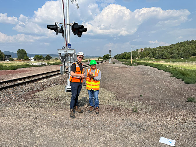 Rafer Nichols, BNSF manager of public projects, left, presents the Tracking to Zero award to Jennifer Pierce of NMDOT. Rafer Nichols, BNSF manager of public projects, left, presents the Tracking to Zero award to Jennifer Pierce of NMDOT.