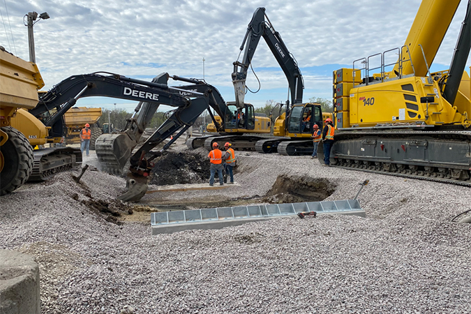 Crews excavate a space for the new scale’s foundation. The scale is used to weigh railcars. Crews excavate a space for the new scale’s foundation. The scale is used to weigh railcars.