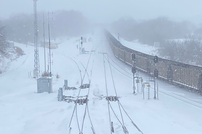 In Lincoln, Nebraska, a coal train seems to stretch into infinity, a result of whiteout conditions. In Lincoln, Nebraska, a coal train seems to stretch into infinity, a result of whiteout conditions.