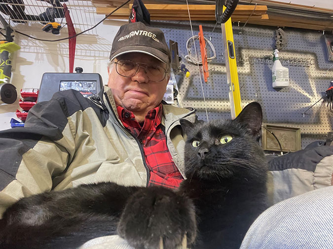 Haubrich with a cat named Ebony that he fostered Haubrich with a cat named Ebony that he fostered